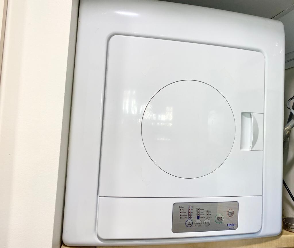 Very small dryer. One or two garment at a time 